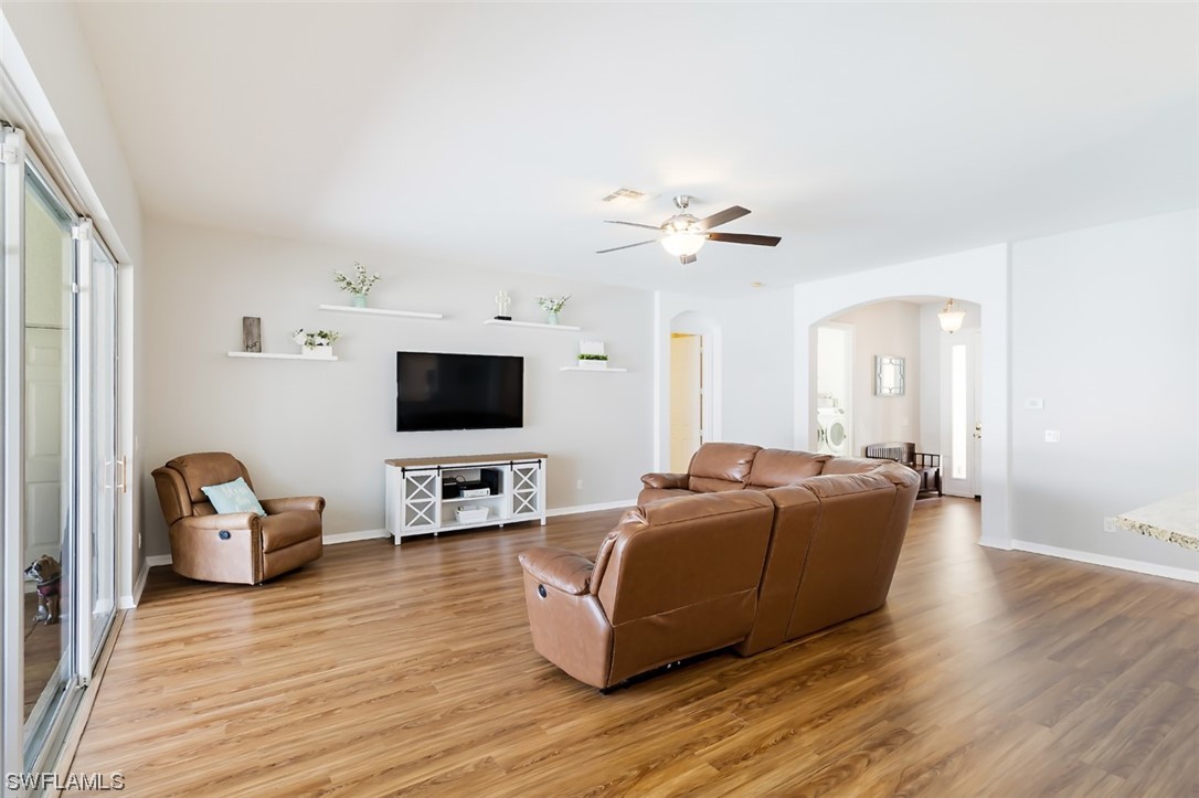 12893 Timber Ridge Drive Fort Myers, FL 33913 - Photo 6 of 30 a living room with furniture and a flat screen tv