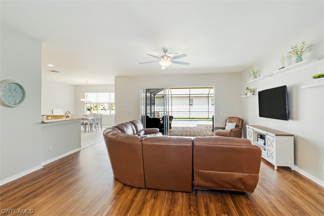 12893 Timber Ridge Drive Fort Myers, FL 33913 - Photo 8 of 30 a living room with furniture and a flat screen tv