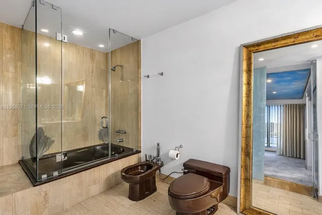 a bathroom with double vanity sinks and a mirror