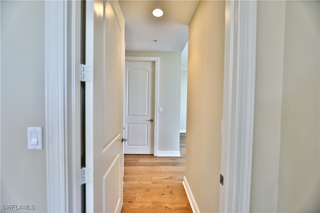 2104 West First Street, Unit 2804 Fort Myers, FL 33901 - Photo 18 of 49 a view of a bathroom from a hallway