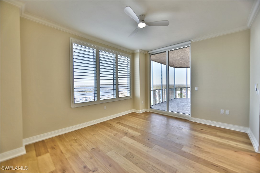 2104 West First Street, Unit 2804 Fort Myers, FL 33901 - Photo 20 of 49 a view of an empty room with wooden floor and a window