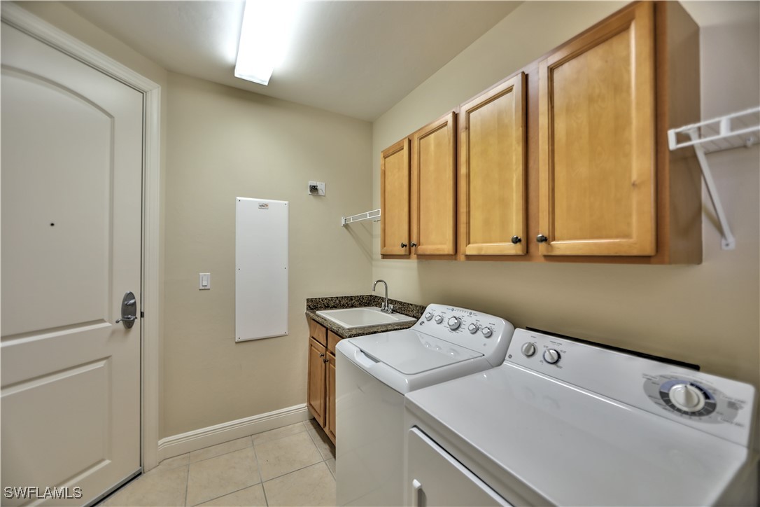 2104 West First Street, Unit 2804 Fort Myers, FL 33901 - Photo 32 of 49 a utility room with dryer and washer