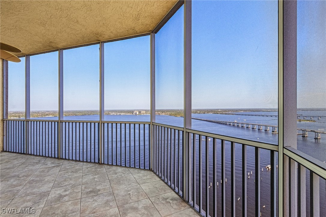 2104 West First Street, Unit 2804 Fort Myers, FL 33901 - Photo 6 of 49 a view of balcony with floor to ceiling window and wooden floor