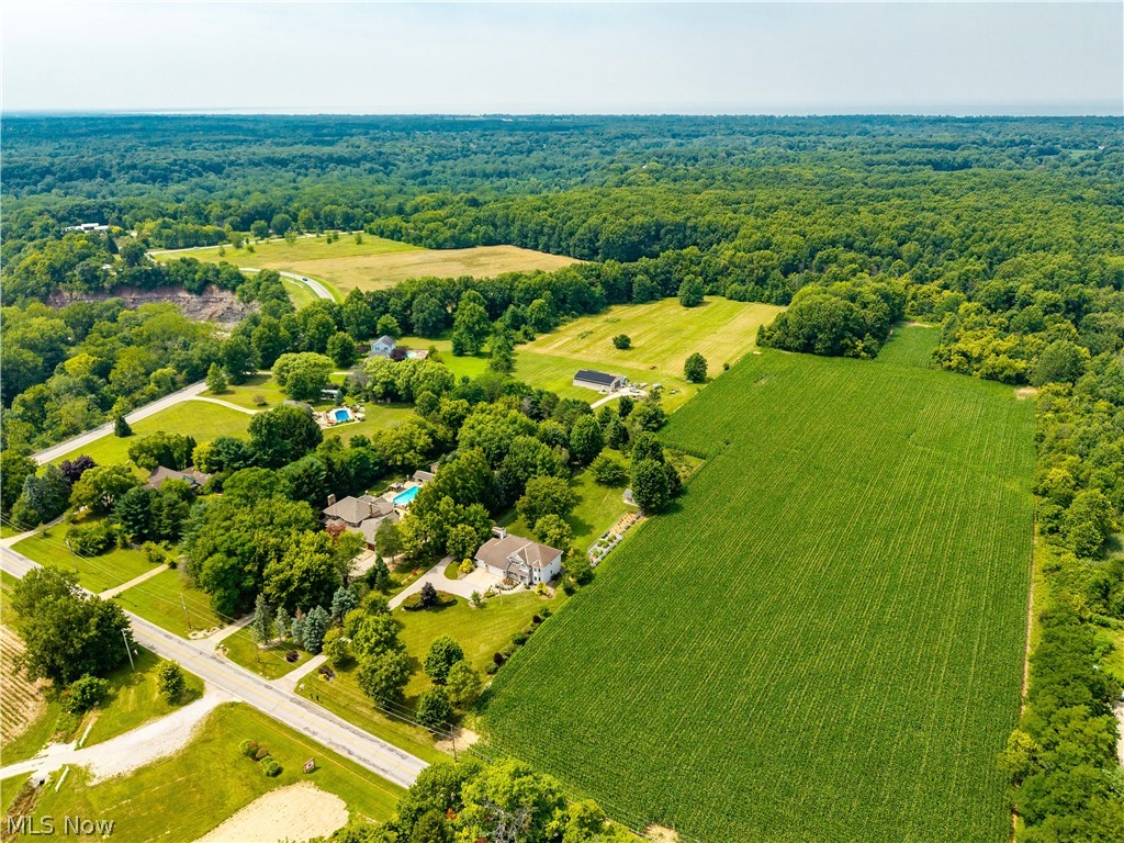 3270 North Ridge Road Vermilion, OH 44089 - Photo 46 of 49 Expansive acreage featuring cultivated fields, wooded areas, and scattered residential properties with pools