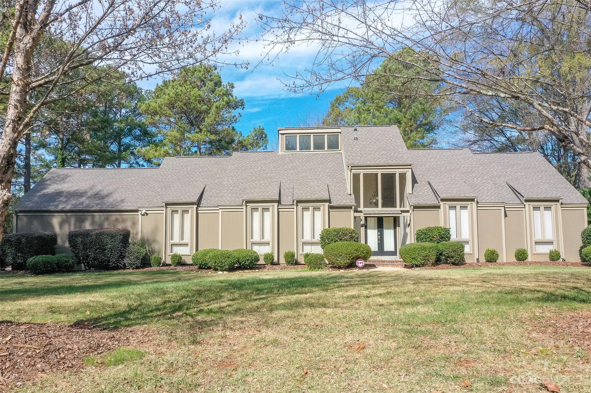 4810 Rounding Run Road Charlotte, NC 28277 - Photo 1 of 42 a front view of a house with a yard