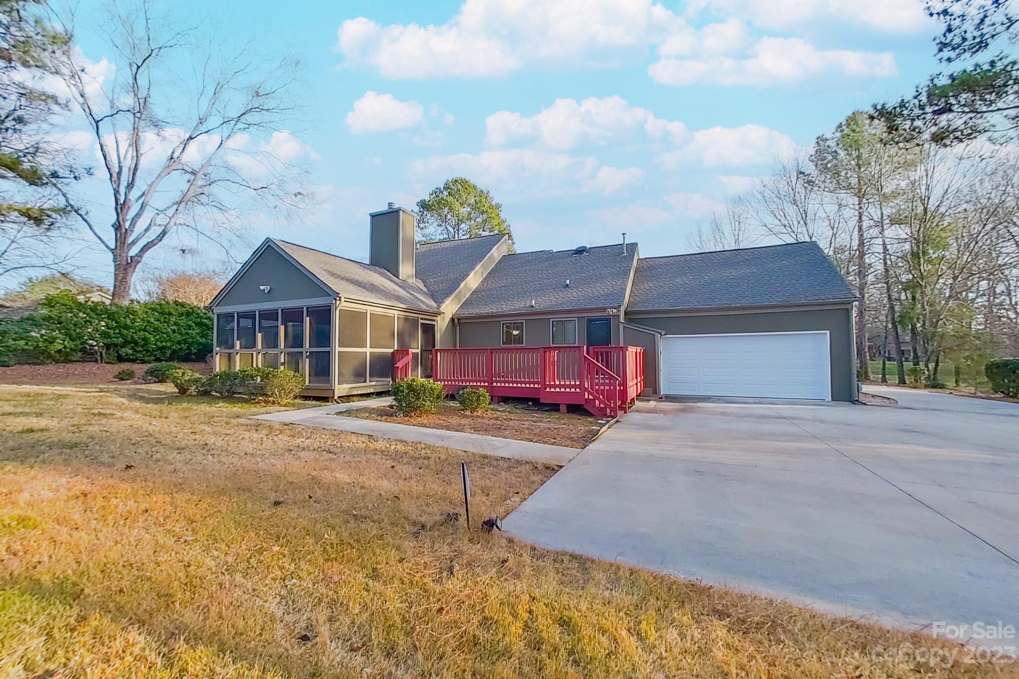 4810 Rounding Run Road Charlotte, NC 28277 - Photo 13 of 42 a front view of a house with parking space and trees