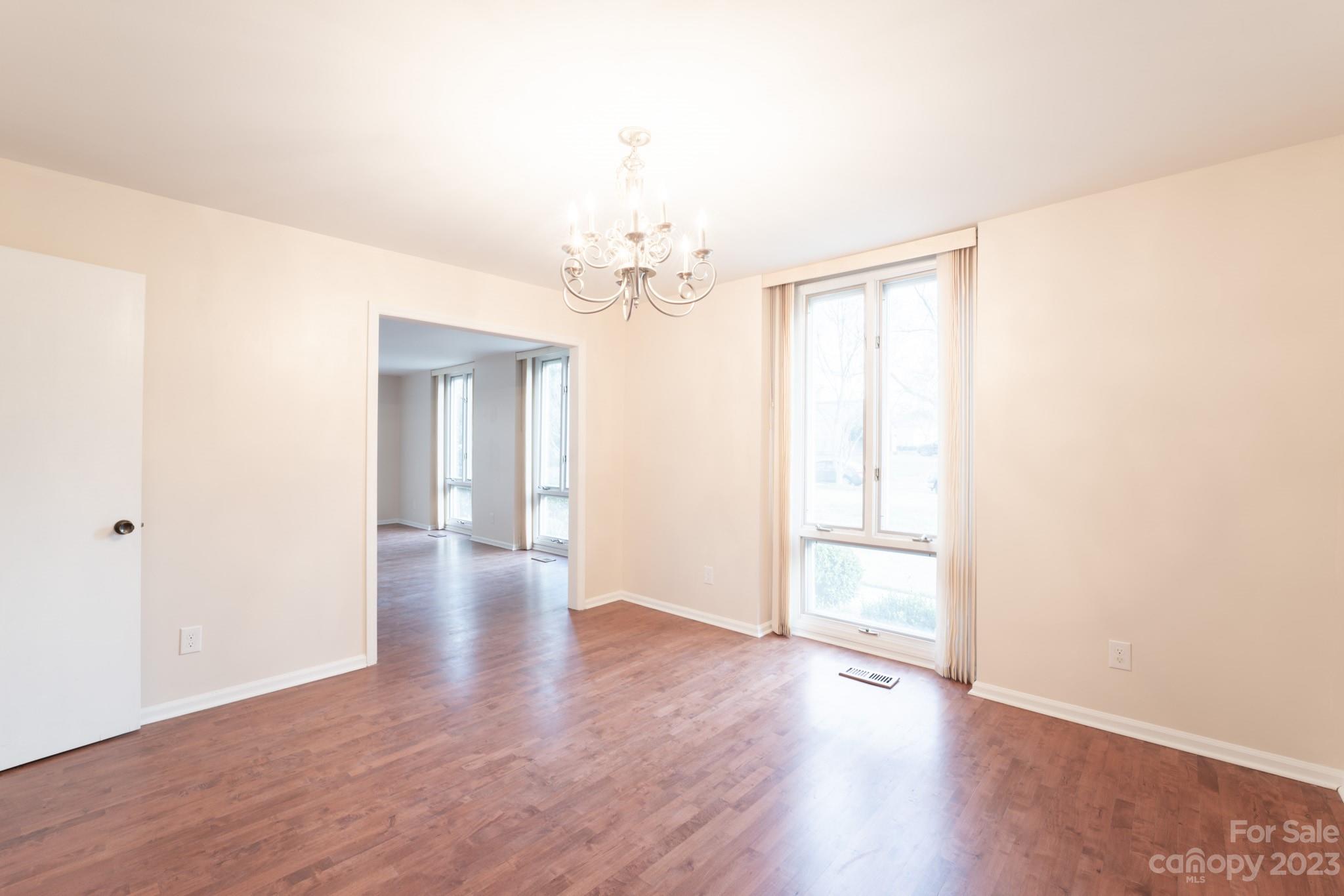 4810 Rounding Run Road Charlotte, NC 28277 - Photo 18 of 42 a view of an empty room with wooden floor