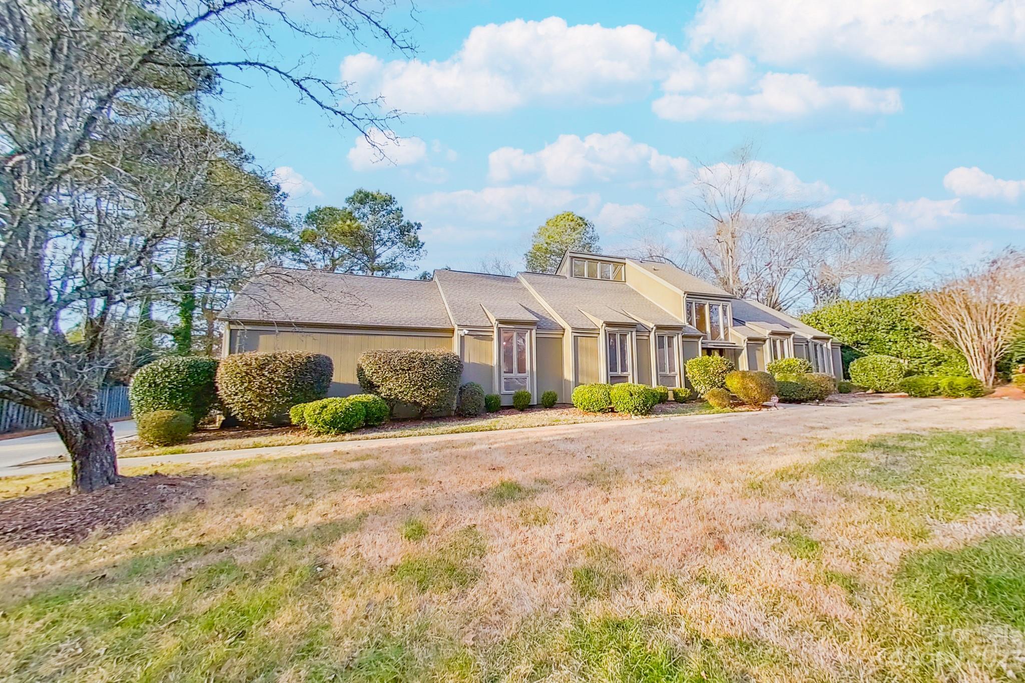 4810 Rounding Run Road Charlotte, NC 28277 - Photo 2 of 42 a front view of a house with a yard and table and chairs