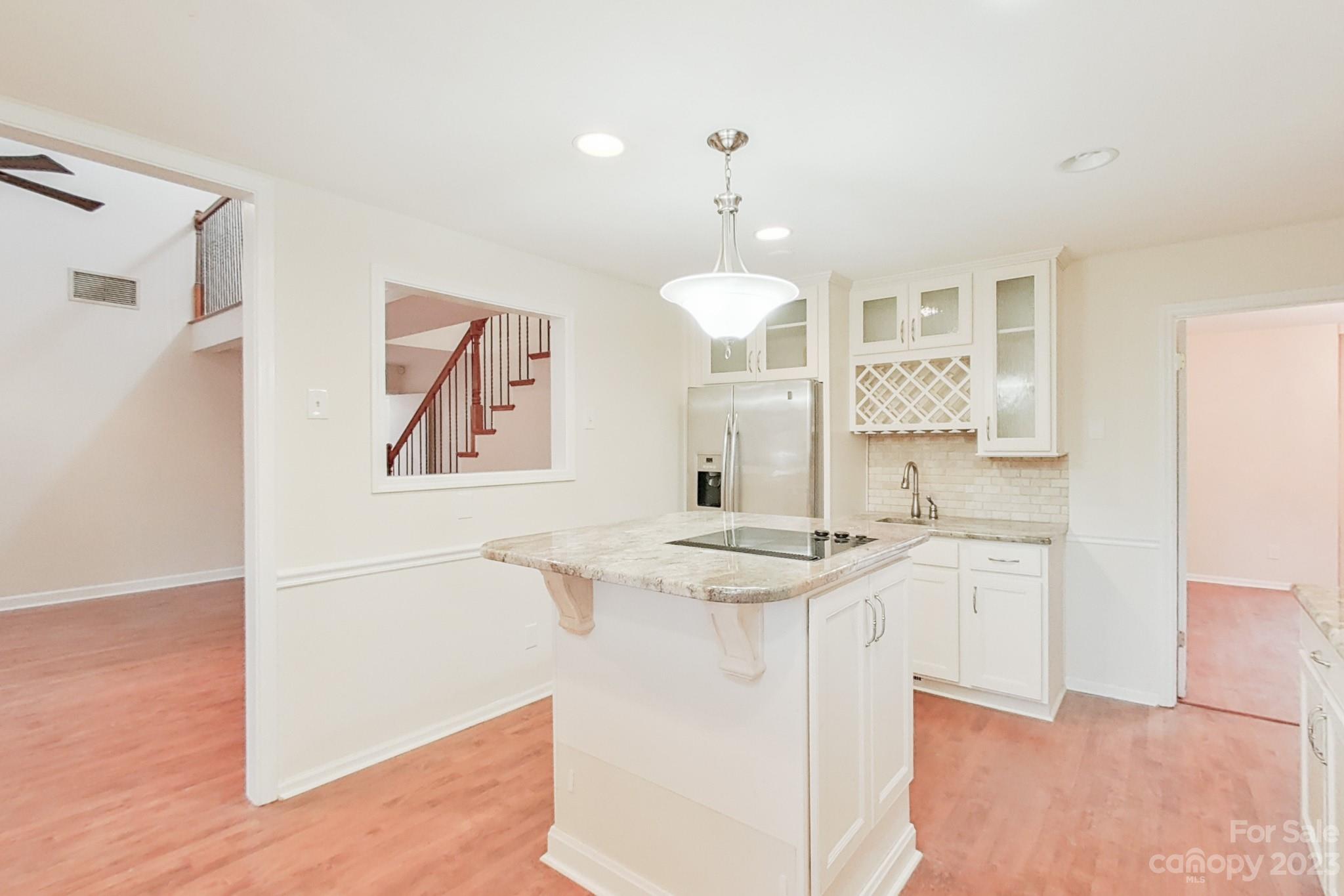 4810 Rounding Run Road Charlotte, NC 28277 - Photo 24 of 42 a kitchen with stainless steel appliances granite countertop a sink and a refrigerator