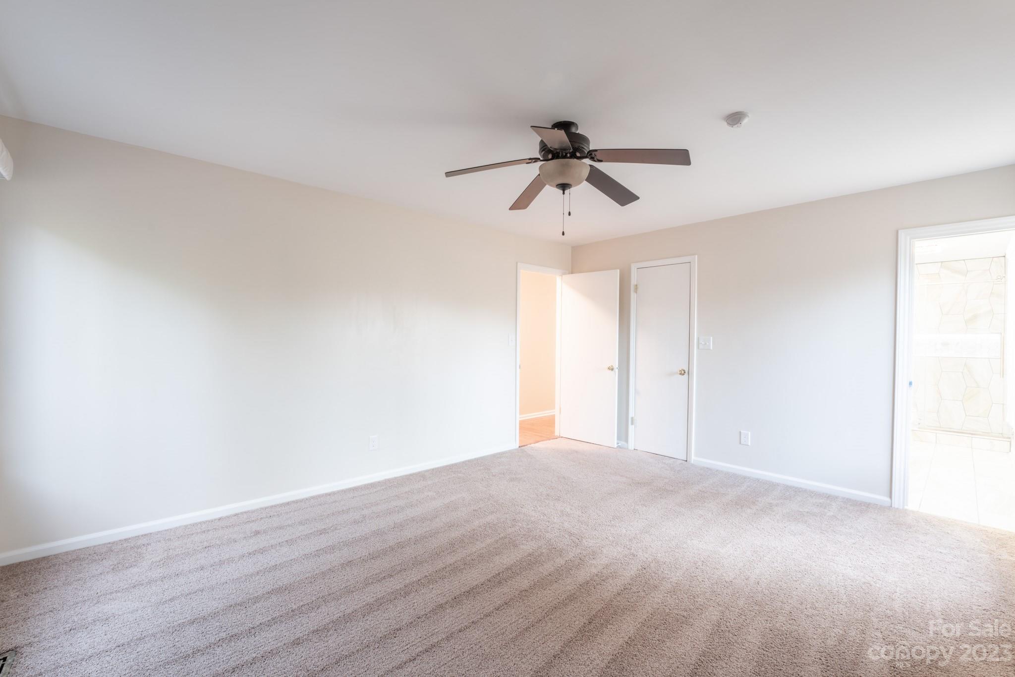 4810 Rounding Run Road Charlotte, NC 28277 - Photo 29 of 42 a view of room with a ceiling fan and wooden floor
