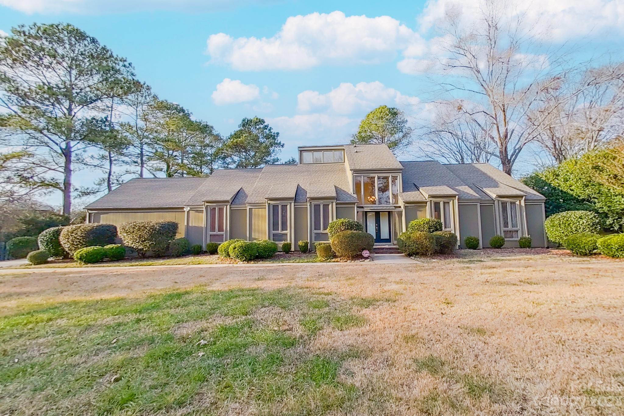 4810 Rounding Run Road Charlotte, NC 28277 - Photo 3 of 42 a front view of a house with a garden