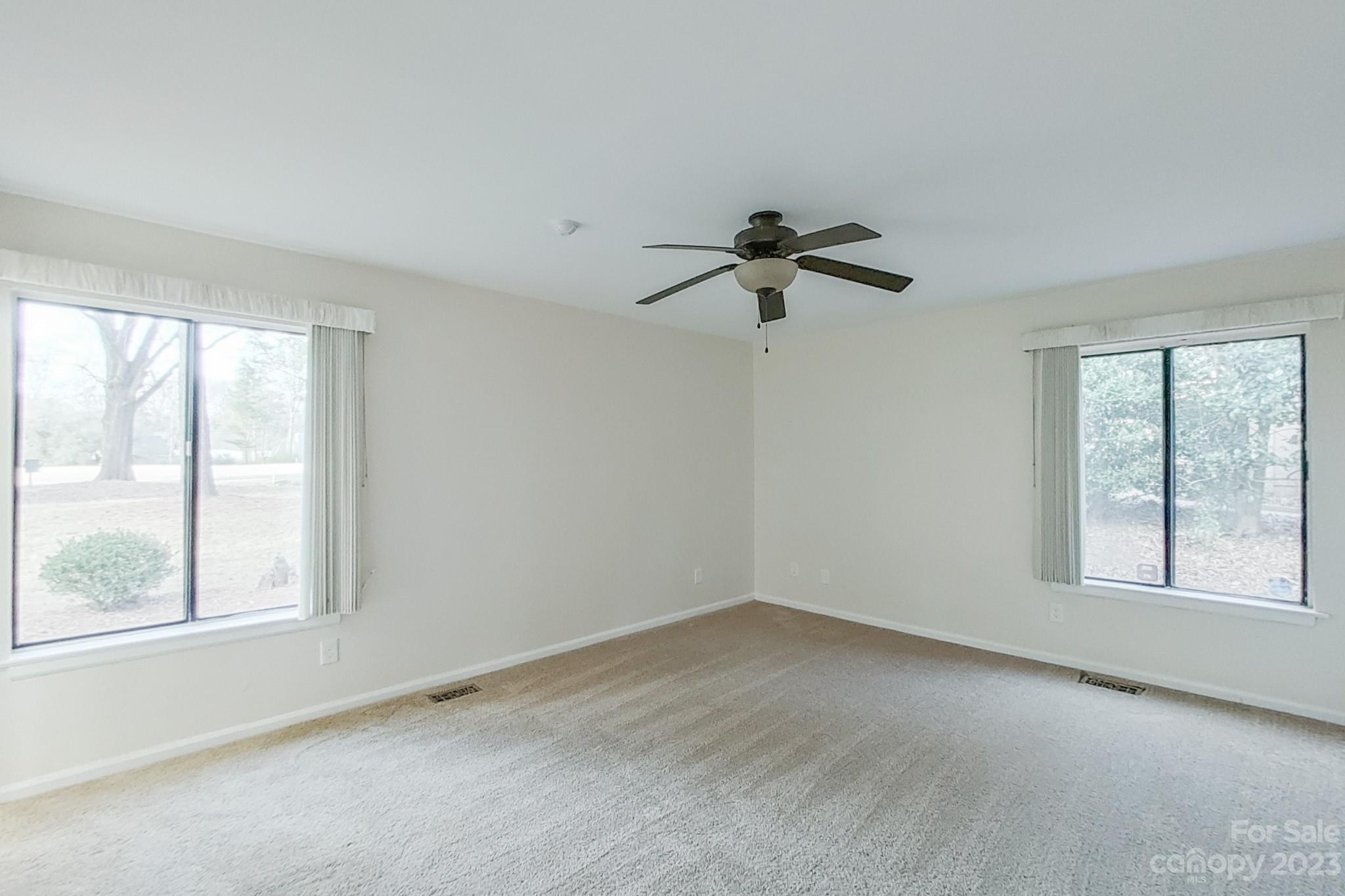 4810 Rounding Run Road Charlotte, NC 28277 - Photo 32 of 42 a view of a livingroom with a ceiling fan and window