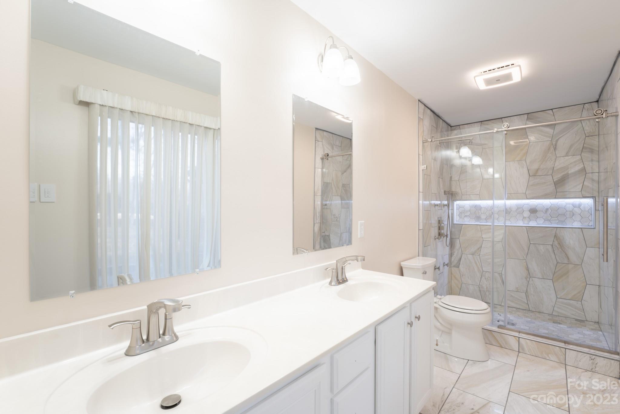 4810 Rounding Run Road Charlotte, NC 28277 - Photo 34 of 42 a bathroom with a sink toilet and shower