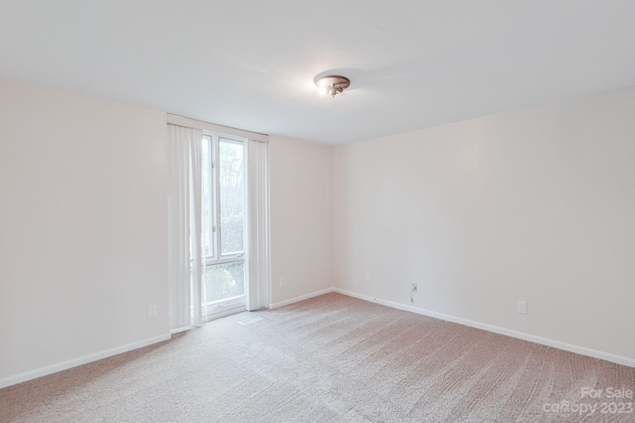 4810 Rounding Run Road Charlotte, NC 28277 - Photo 35 of 42 a view of an empty room with a window