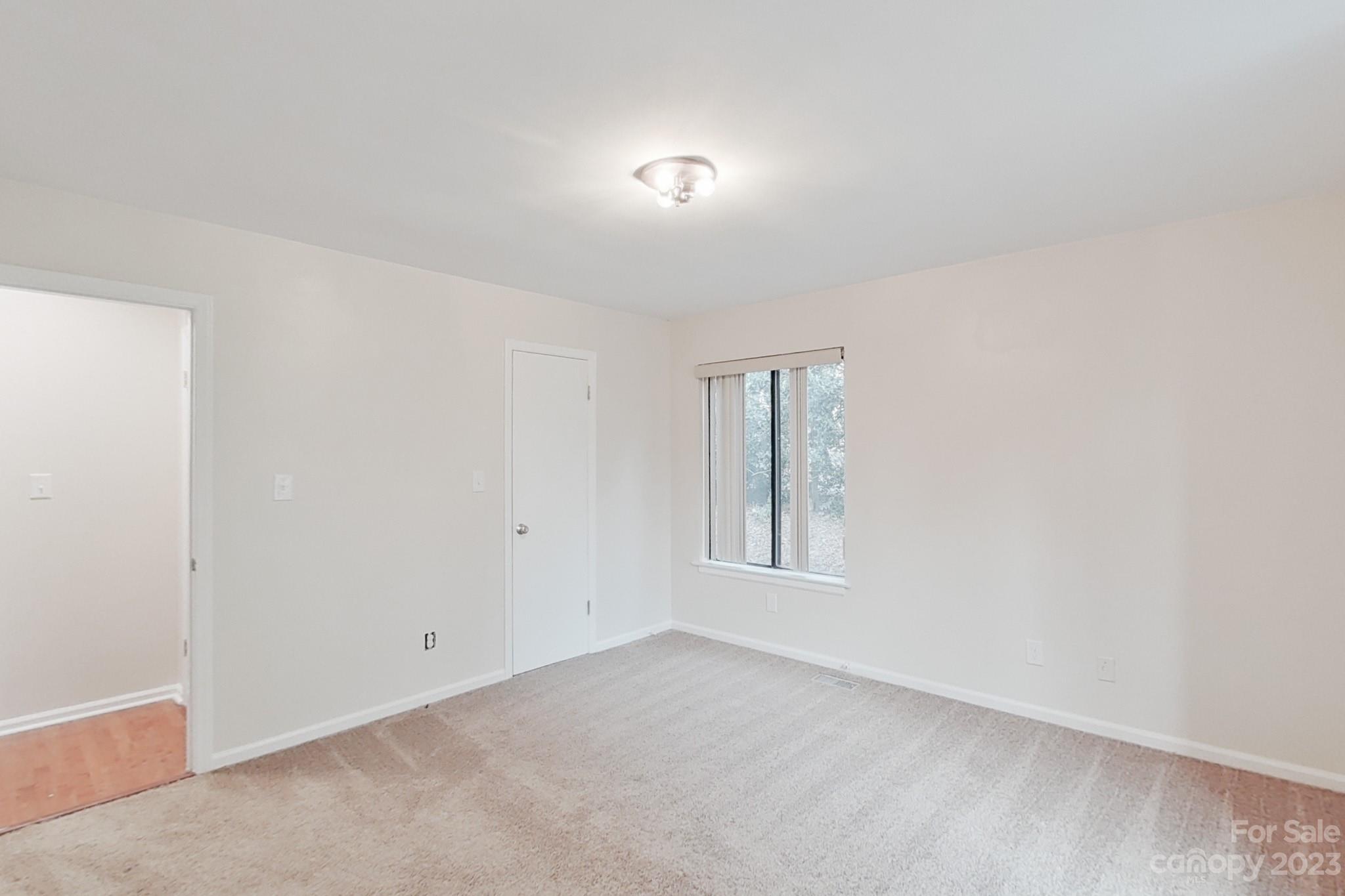 4810 Rounding Run Road Charlotte, NC 28277 - Photo 37 of 42 an empty room with windows