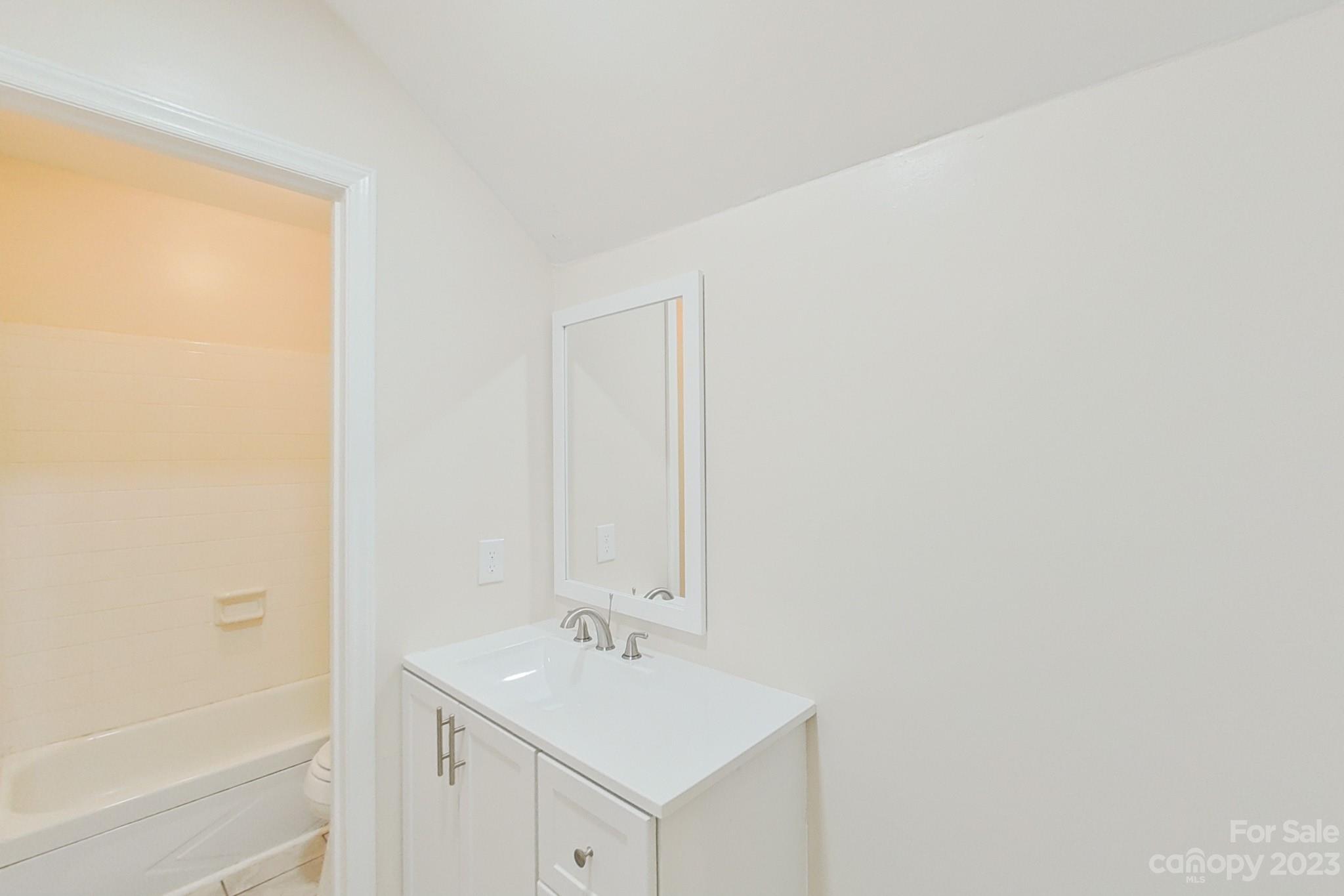 4810 Rounding Run Road Charlotte, NC 28277 - Photo 39 of 42 a bathroom with a sink and a mirror