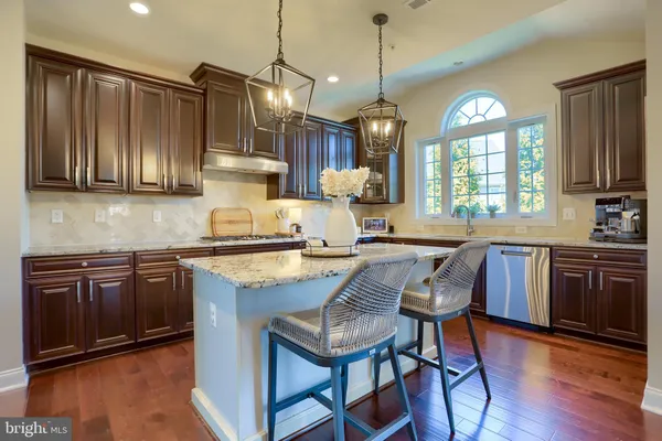 a kitchen with stove and refrigerator