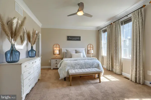a bathroom with a granite countertop sink a mirror and a shower