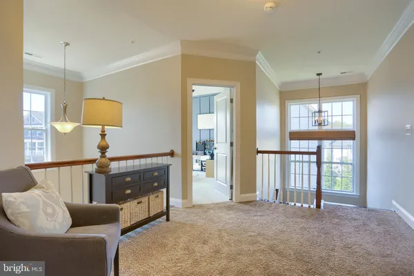 a spacious bedroom with a bed and a television