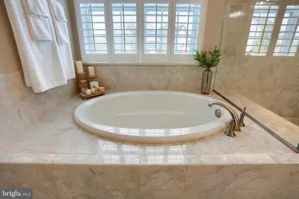 a bedroom with furniture and a wooden floor