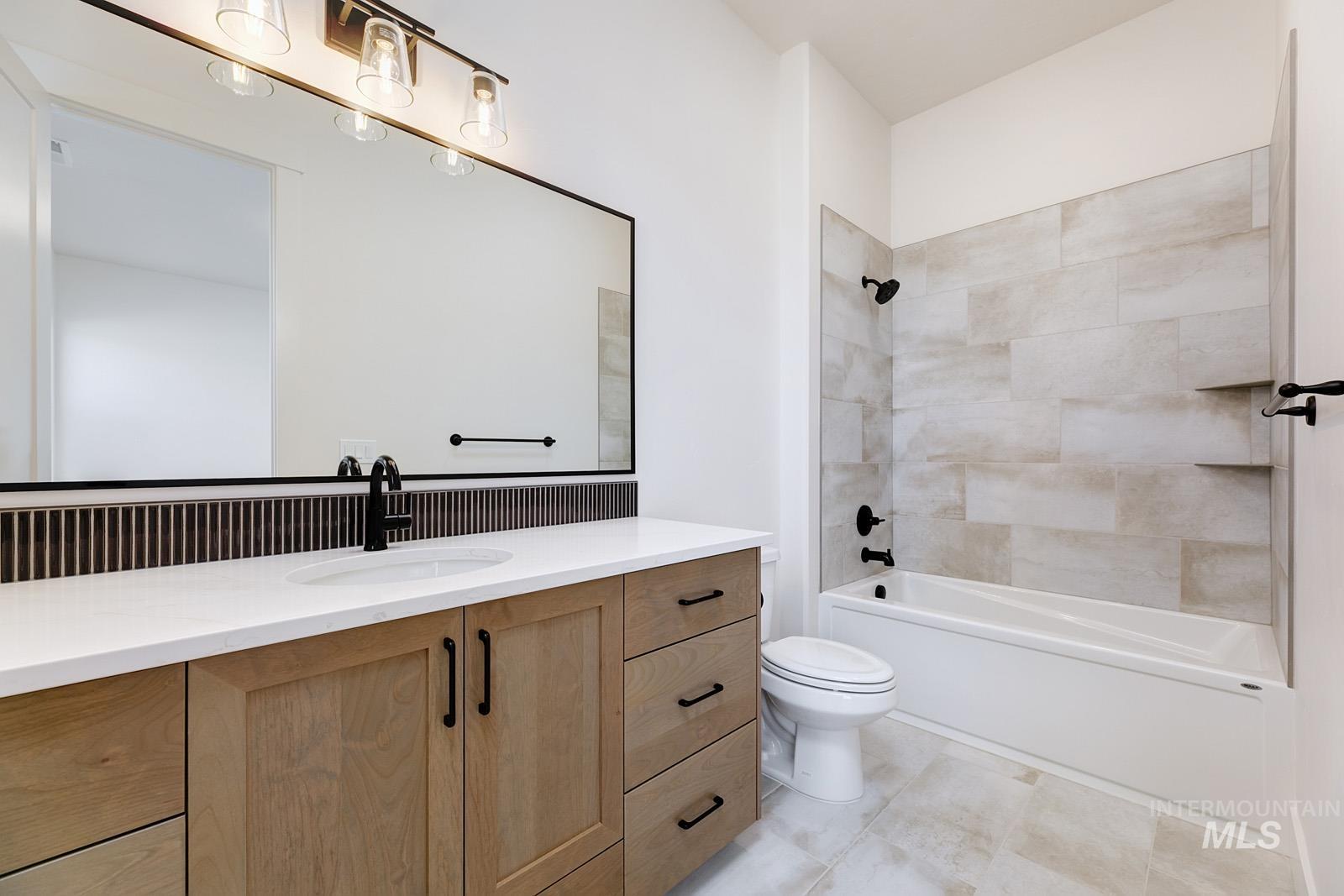 13660 North Spring Creek Way Boise, ID 83714 - Photo 24 of 42 Full bathroom featuring vanity and shower / bathtub combination