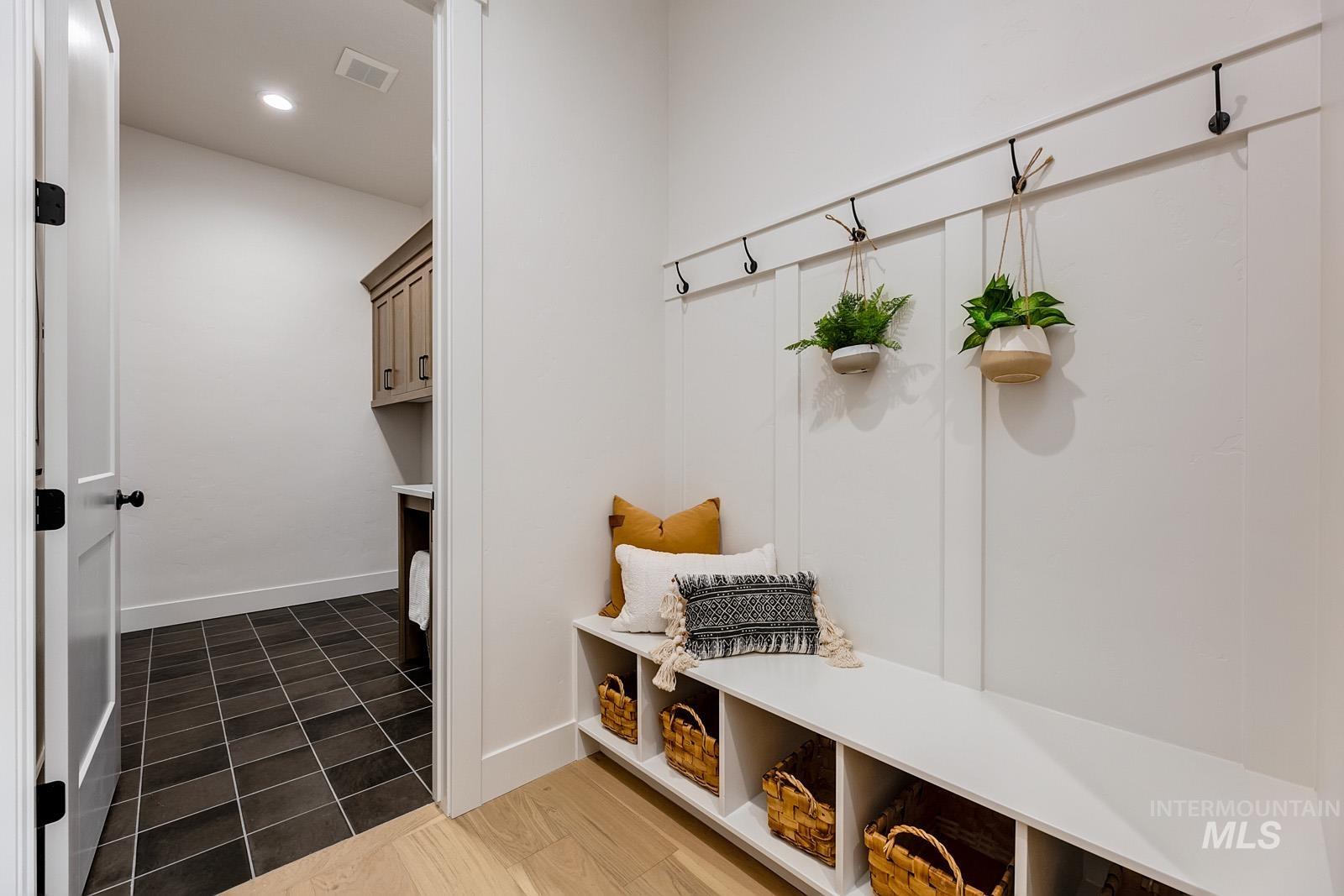 13660 North Spring Creek Way Boise, ID 83714 - Photo 25 of 42 Mudroom featuring recessed lighting and dark tile patterned flooring