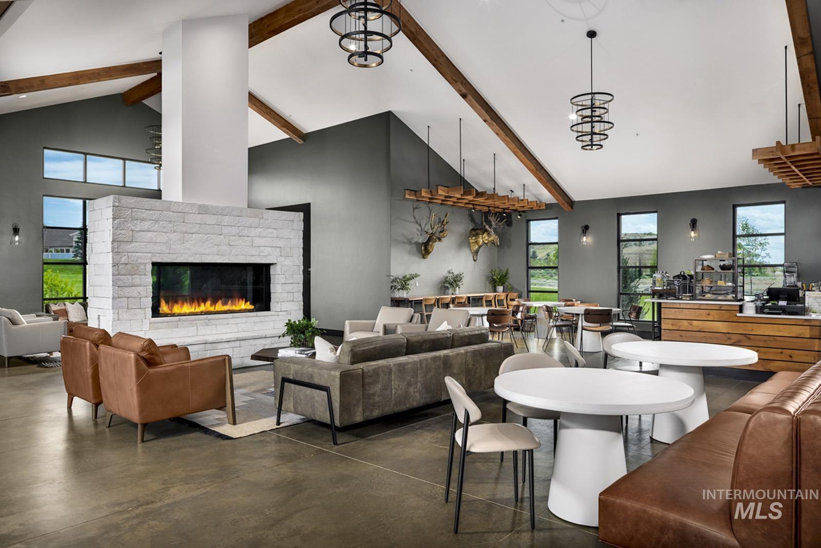 13660 North Spring Creek Way Boise, ID 83714 - Photo 35 of 42 Dining area with finished concrete floors, a brick fireplace, and healthy amount of natural light
