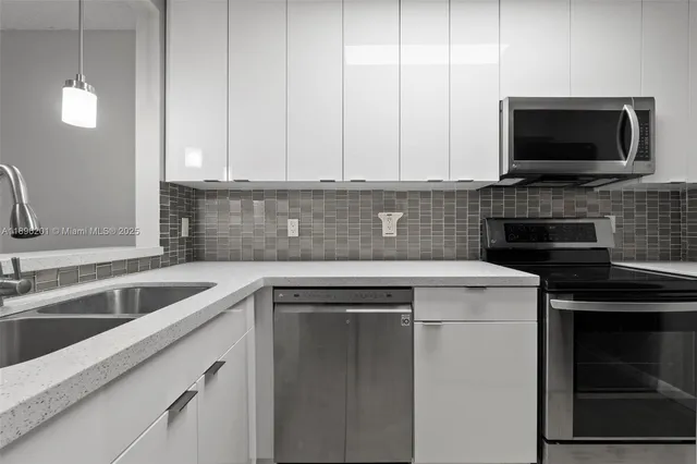 a kitchen with a sink and a microwave