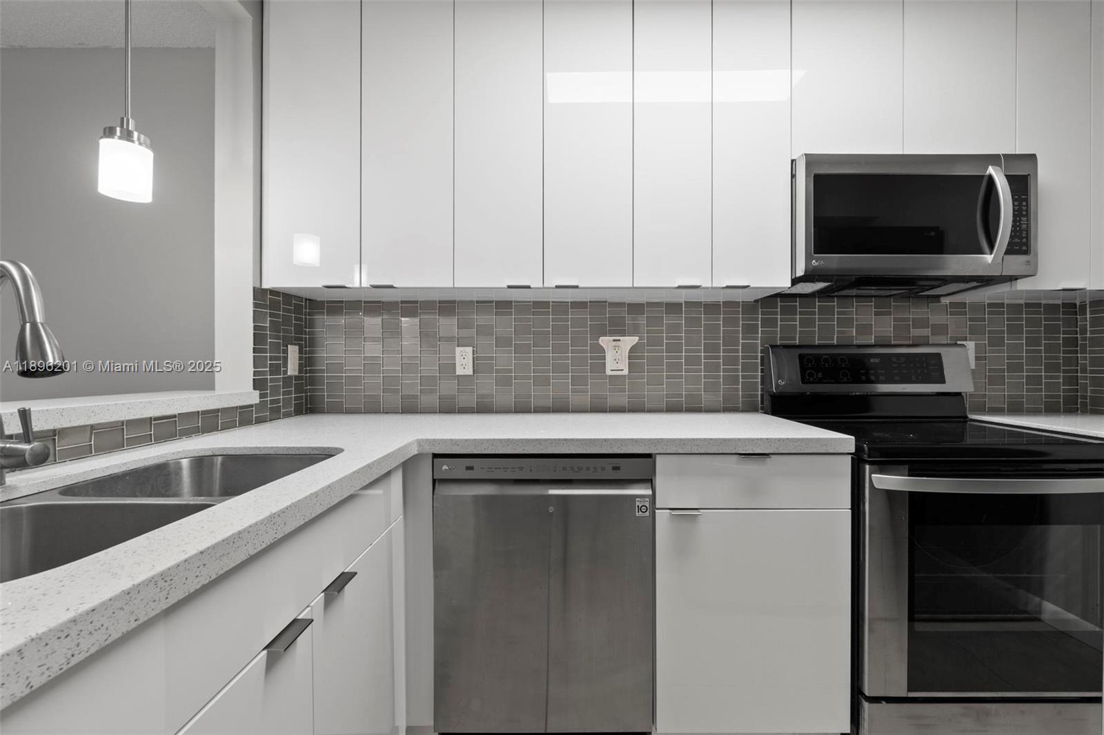 a kitchen with a sink and a microwave