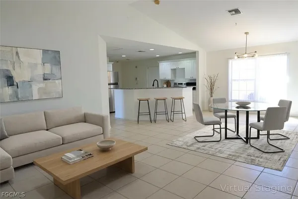 a living room with furniture and a table