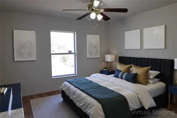 a bedroom with bed and window