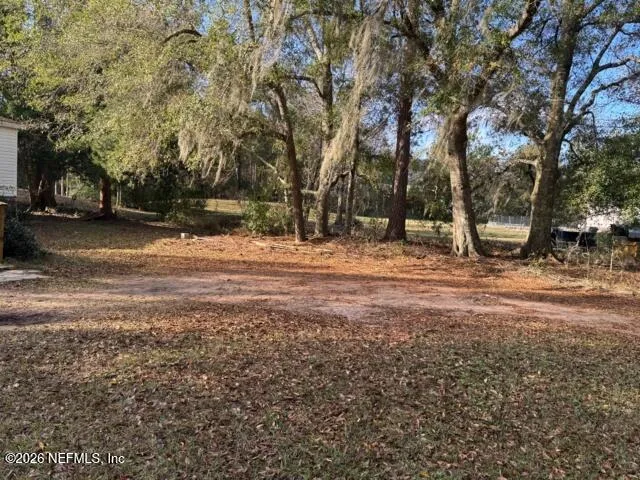 a backyard of a house with lots of green space