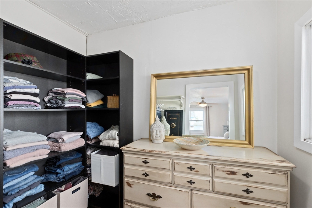 189 Wompatuck Road Hingham, MA 02043 - Photo 18 of 40 a room with a dresser and a mirror