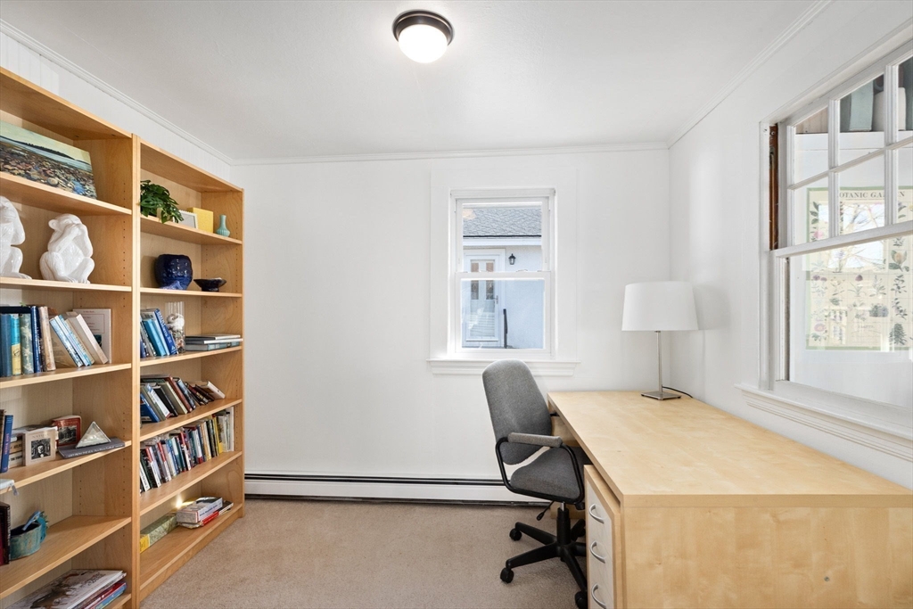 189 Wompatuck Road Hingham, MA 02043 - Photo 20 of 40 a workspace with furniture and a book shelf