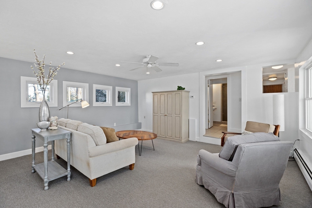 189 Wompatuck Road Hingham, MA 02043 - Photo 28 of 40 a living room with furniture and a potted plant