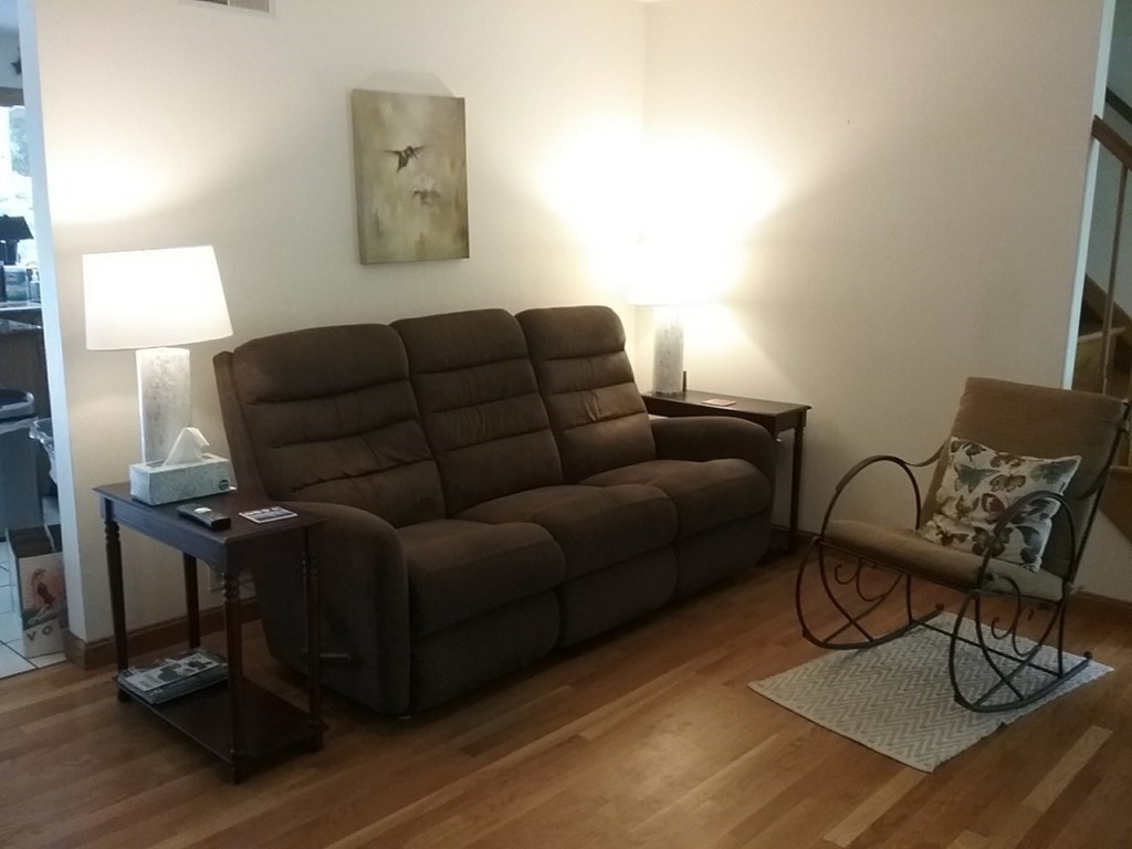 332 Lower Hampden Road Monson, MA 01057 - Photo 11 of 30 a living room with furniture and a lamp