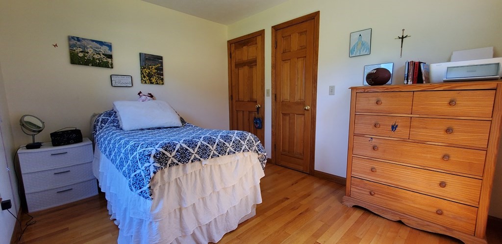 332 Lower Hampden Road Monson, MA 01057 - Photo 18 of 30 a bedroom with a bed and wooden floor