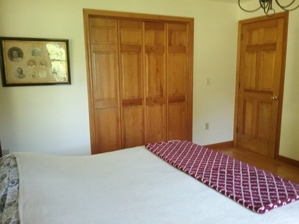 332 Lower Hampden Road Monson, MA 01057 - Photo 21 of 30 a bedroom with a bed and wooden floor