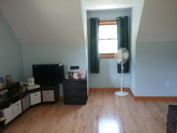 332 Lower Hampden Road Monson, MA 01057 - Photo 23 of 30 a view of workspace with wooden floor windows cabinet and flat screen tv