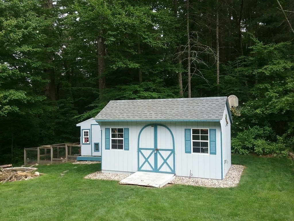 332 Lower Hampden Road Monson, MA 01057 - Photo 5 of 30 a front view of a house with a yard table and chairs