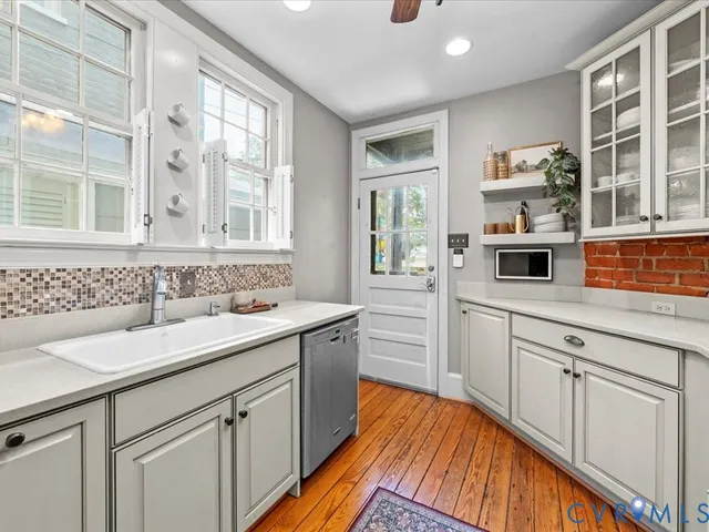 a kitchen with a sink and cabinets