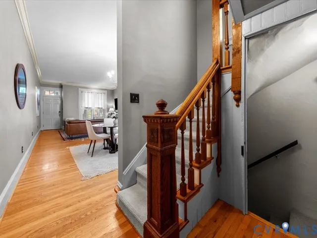 a view of entryway dining room and hall with wooden floor
