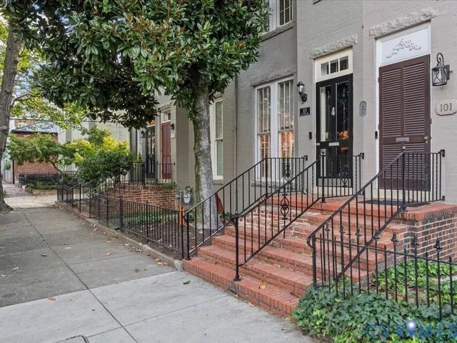 a view of a house with a iron gate