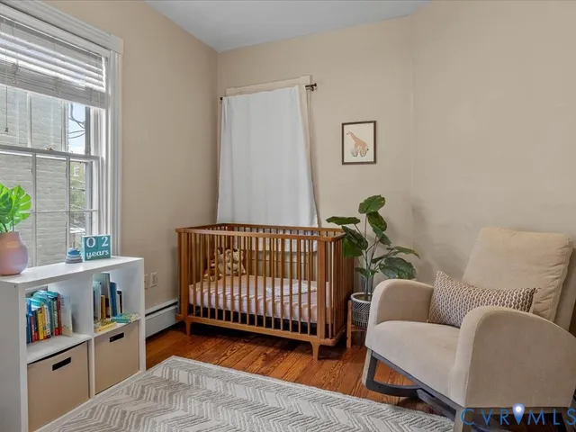 a bedroom with furniture and a window