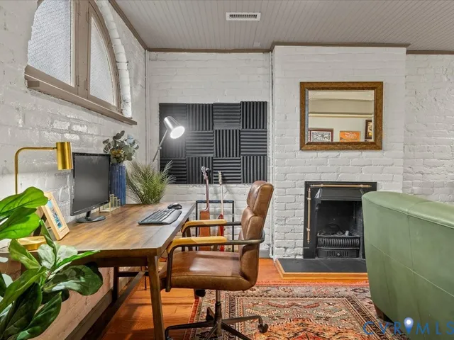 a view of a livingroom with furniture and a fireplace