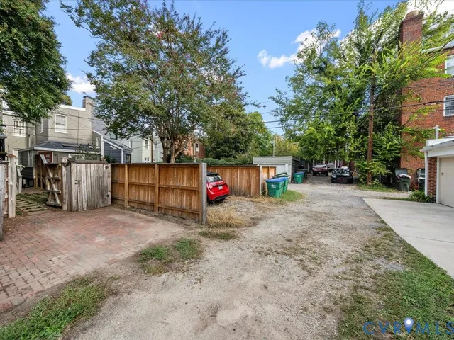 a view of street with parked cars