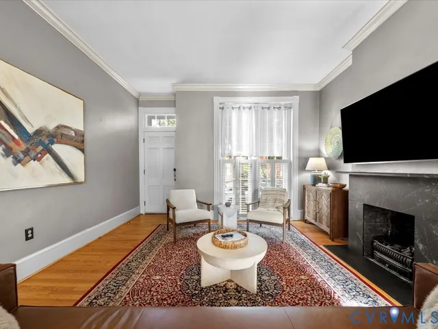a living room with furniture and a flat screen tv