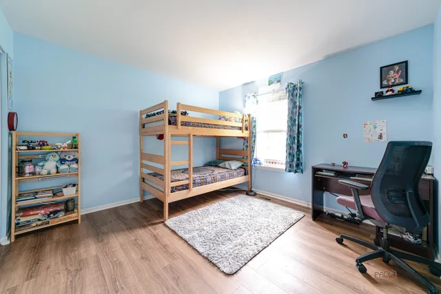 a bedroom with furniture and a window