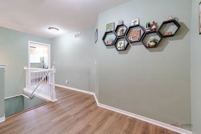 a view of workspace with wooden floor