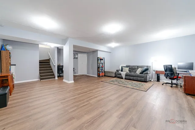 a view of a livingroom with furniture and wooden floor